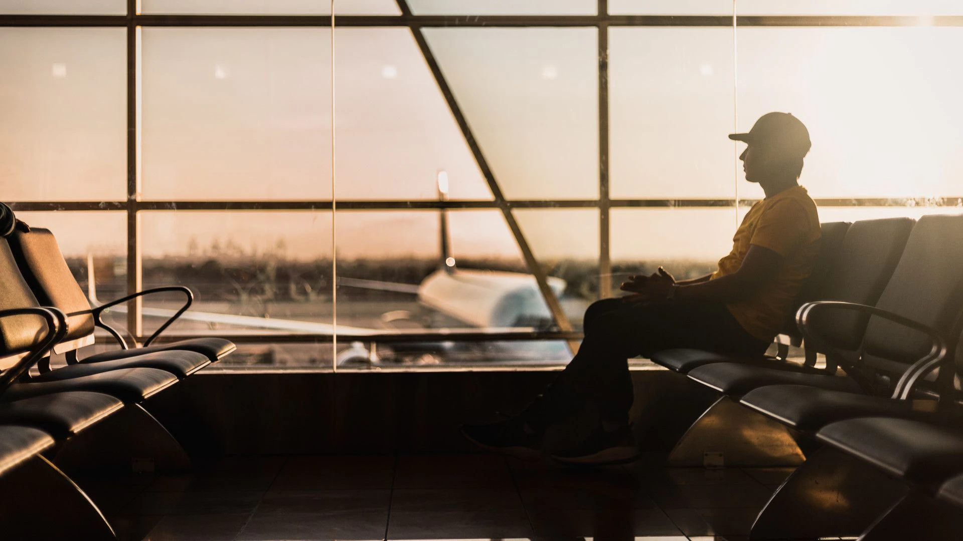 Man at airport waiting for a flight.